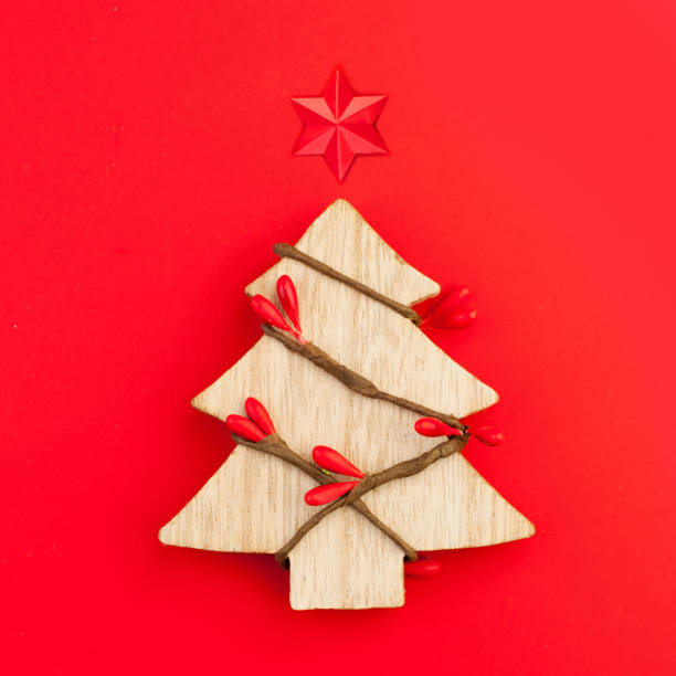 istock Christmas card background. Xmas tree with star concept on red background 1165857755