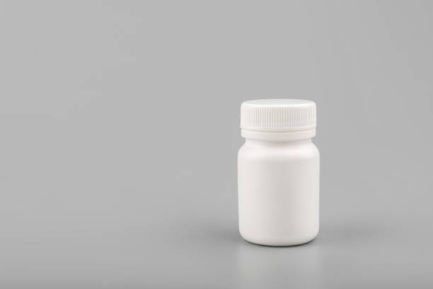 istock medicine white pill bottle on grey background 1165860499