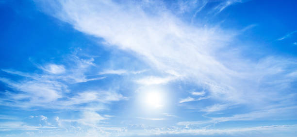 istock Majestic sun and clouds on blue sky 1165860721