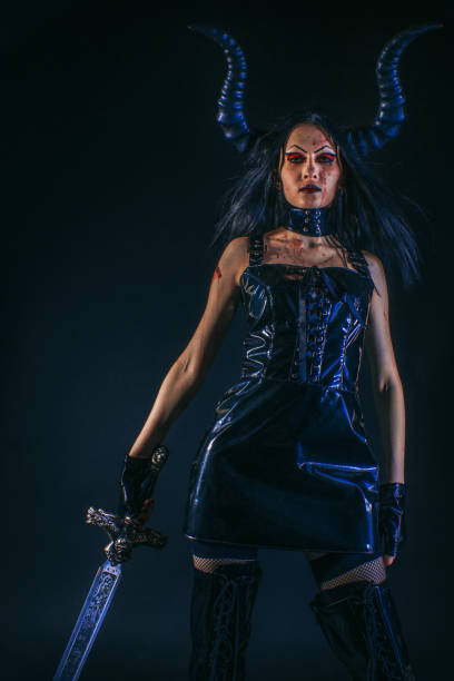 istock Gothic horned girl with sword 1165863070