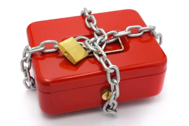 Photo of protected cash box with chain and padlock