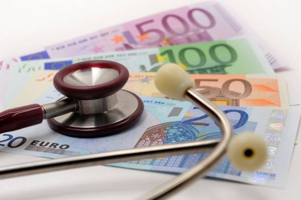 medical stethoscope and banknotes of Euro currency stock photo