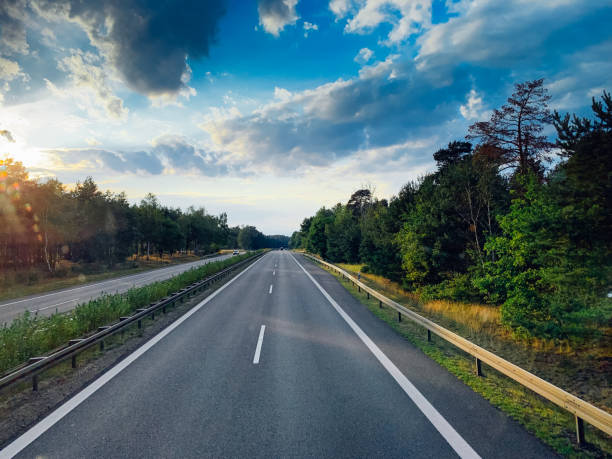 istock Asphalt road and beautiful nature landscape 1165866650
