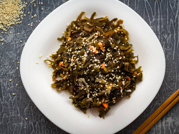 istock Seaweed salad with sesame seeds is on a white plate 1165866684