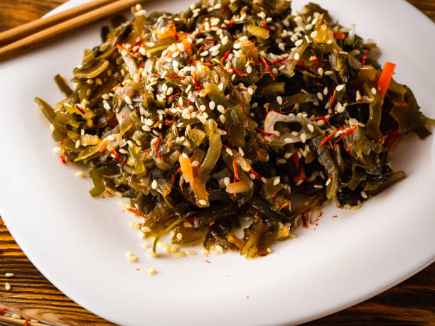istock Seaweed salad with sesame seeds is on a white plate 1165866696