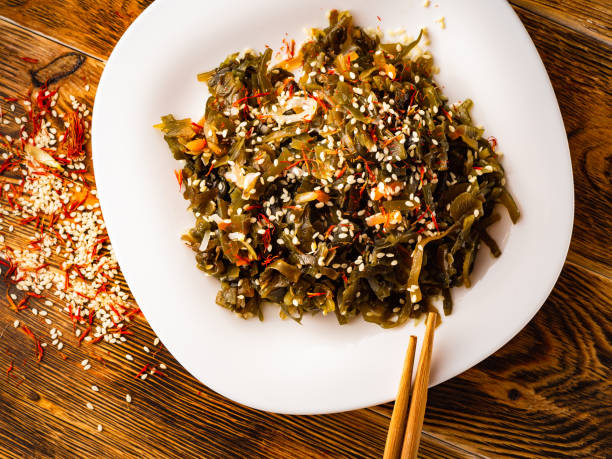 istock Seaweed salad with sesame seeds is on a white plate 1165866762