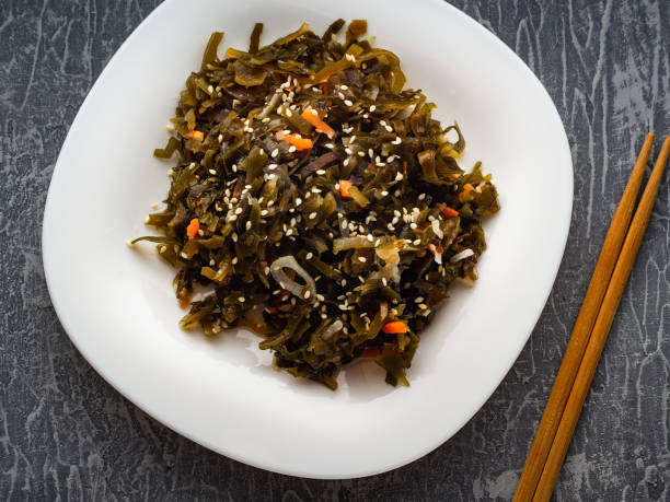 istock Seaweed salad with sesame seeds is on a white plate 1165866922