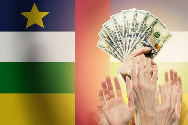 istock People raising hands with dollars and  flag Central African Repu 1165869679