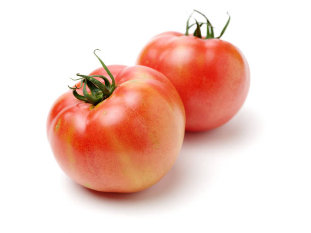 istock fresh tomato isolated on white background 1165871858