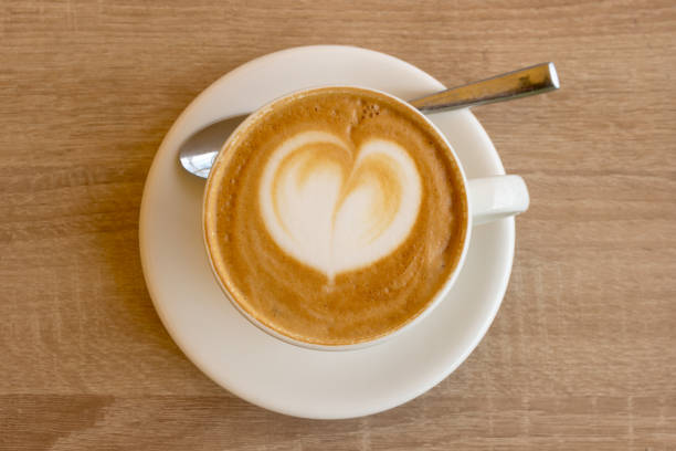 istock Coffee with milk cream on wooden table 1165871901