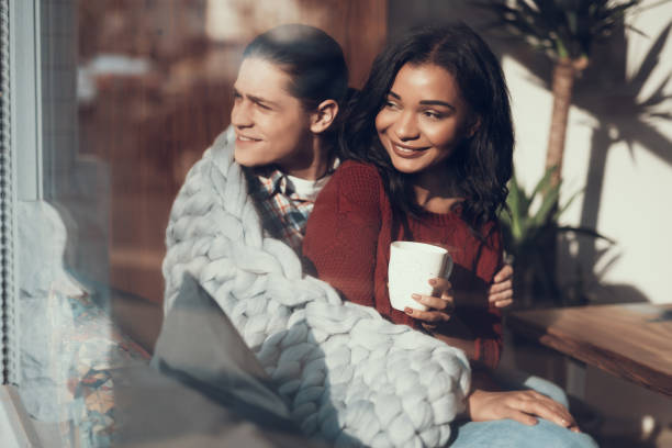 istock Cheerful couple hugging and looking into the distance with smile 1165872076