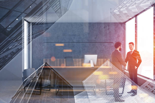 istock Businessmen shaking hands in CEO office 1165873975