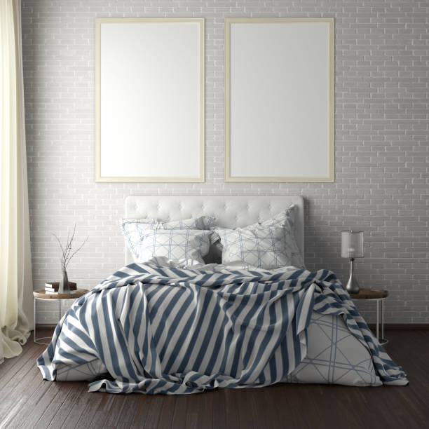 istock poster frame mockups above the bed on the wall in bedroom 1165874951