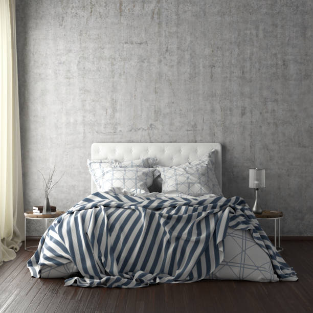 istock poster frame mockups above the bed on the wall in bedroom 1165874953