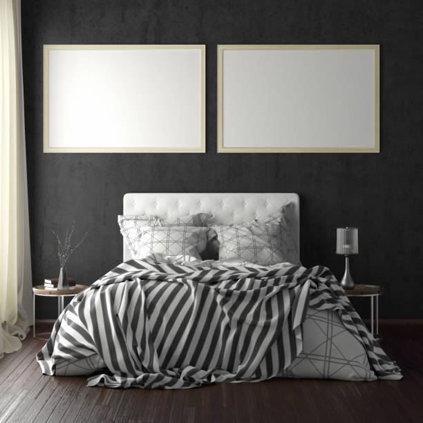 istock poster frame mockups above the bed on the wall in bedroom 1165874983