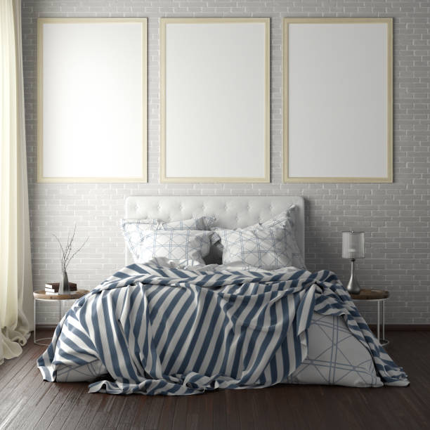 istock poster frame mockups above the bed on the wall in bedroom 1165875020