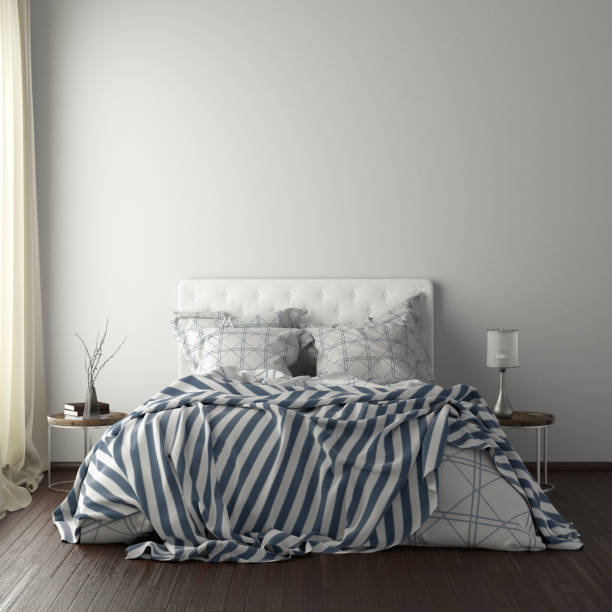 istock poster frame mockups above the bed on the wall in bedroom 1165875044