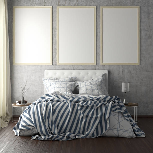 istock poster frame mockups above the bed on the wall in bedroom 1165875051