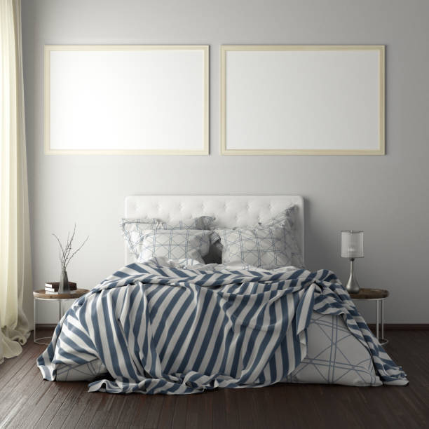 istock poster frame mockups above the bed on the wall in bedroom 1165875060