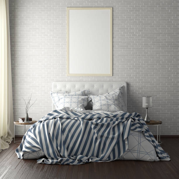 istock poster frame mockups above the bed on the wall in bedroom 1165875061
