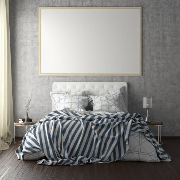 istock poster frame mockups above the bed on the wall in bedroom 1165875078