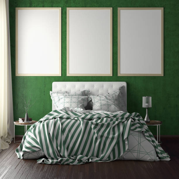 istock poster frame mockups above the bed on the wall in bedroom 1165875084