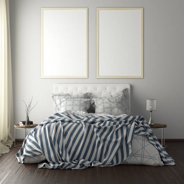 istock poster frame mockups above the bed on the wall in bedroom 1165875087