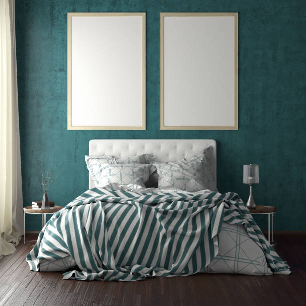 istock poster frame mockups above the bed on the wall in bedroom 1165875099