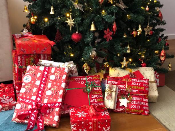 istock Beautifully wrapped Christmas presents under the tree 1165875110