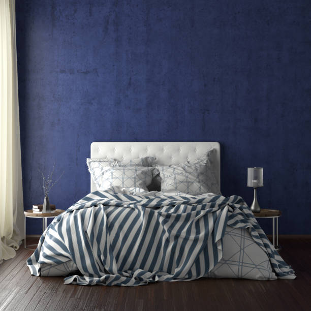 istock poster frame mockups above the bed on the wall in bedroom 1165875114