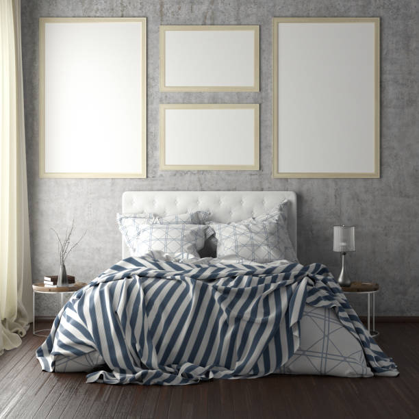 istock poster frame mockups above the bed on the wall in bedroom 1165875195