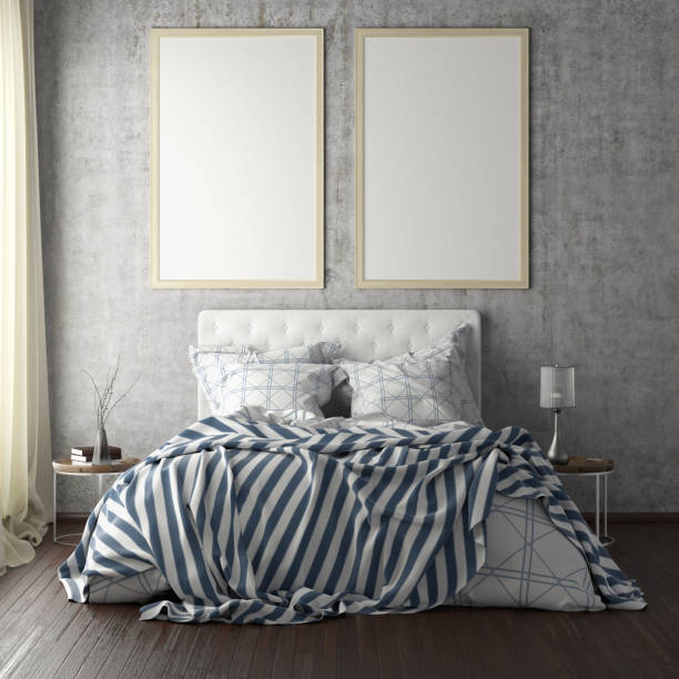 istock poster frame mockups above the bed on the wall in bedroom 1165875208