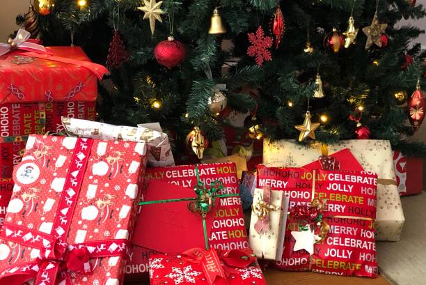 istock Beautifully wrapped Christmas presents under the tree 1165875255