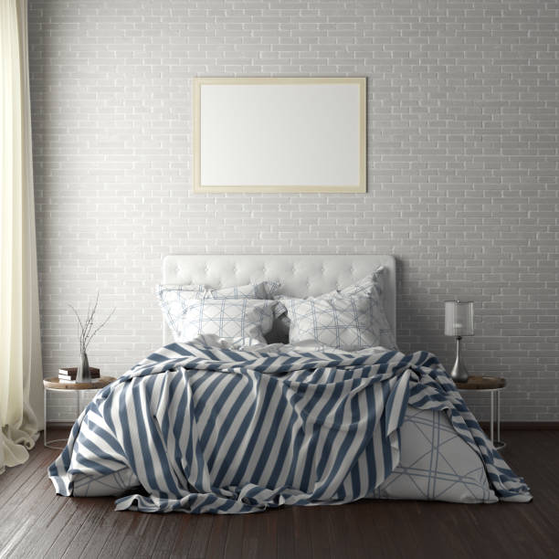 istock poster frame mockups above the bed on the wall in bedroom 1165875279