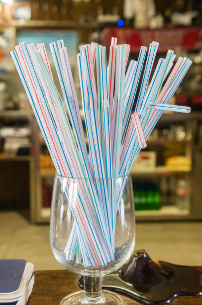 istock A glass with bendy straws on the counter in a bar. 1165879511
