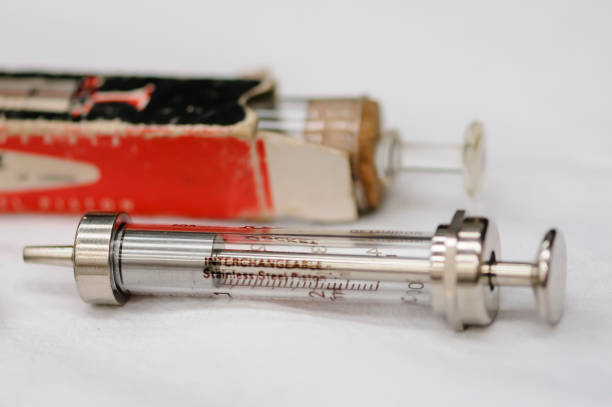 Medical equipment from World War 1 Glass syringe dating from around 1914. 1910 1919 photos stock pictures, royalty-free photos & images