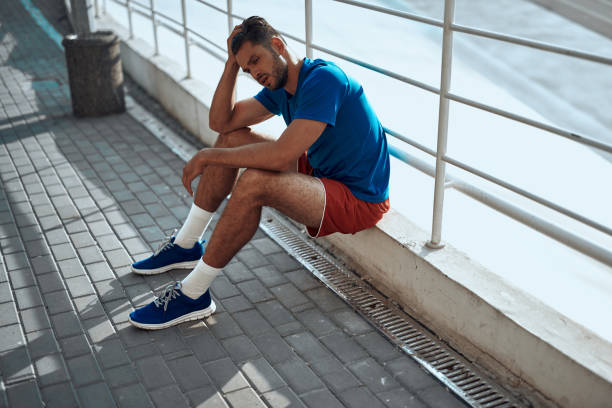istock Sporty man resting afret hard outdor training 1165882116