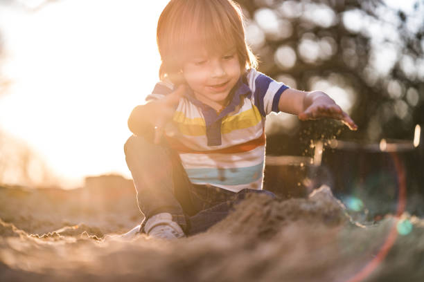 istock Boy love to play with sand 1165882375