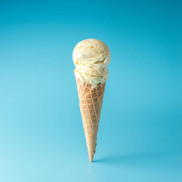 istock Ice cream scoop with ice cream cone on bright background. Minimal summer concept. 1165882433