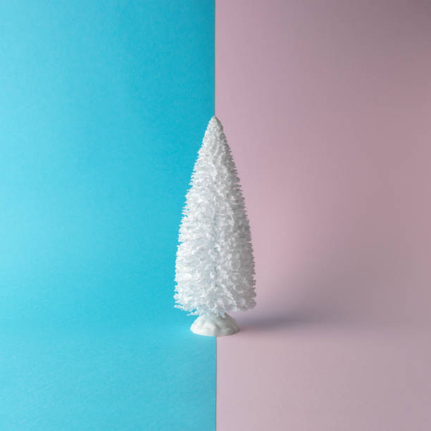 istock Snowy Christmas tree on bright background. Christmas or New Year minimal concept. 1165882440