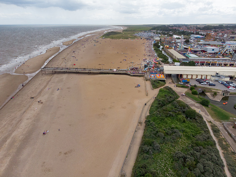 Aerial photo of the British seaside town of Skegness in the East Lindsey a district of Lincolnshire, England, showing the beach and pier on a beautiful sunny day.