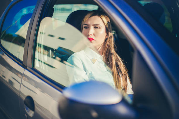 istock Young business Woman in car. 1165883664