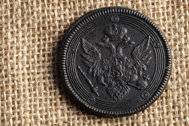 istock on canvas fabric is an old Russian coin with a double-headed eagle, a copper coin 1165883756