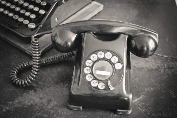 istock Closeup of old typewriter and telephone 1165885665
