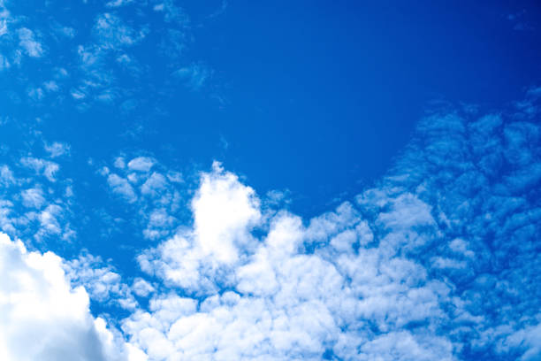 istock Blue sky with clouds on a bright sunny day. 1165889542