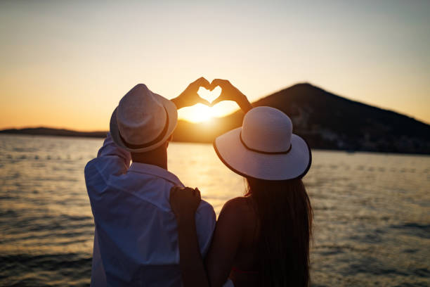 istock Romantic couple in love enjoying vacation on beach at summer 1165890577