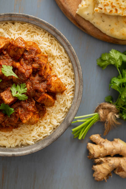 istock Indian Food Chicken Vindaloo Curry over Basmati Rice 1165894106