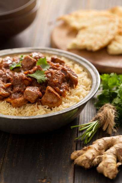 istock Indian Food Chicken Vindaloo Curry over Basmati Rice 1165894765