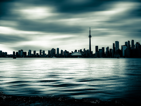 Toronto, Ontario, Canada - July 28, 2019:  The Toronto city skyline as seen from Centre Island at dusk.