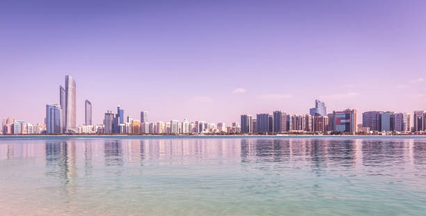 istock Abu Dhabi Skyline with skyscrapers with water 1165897185